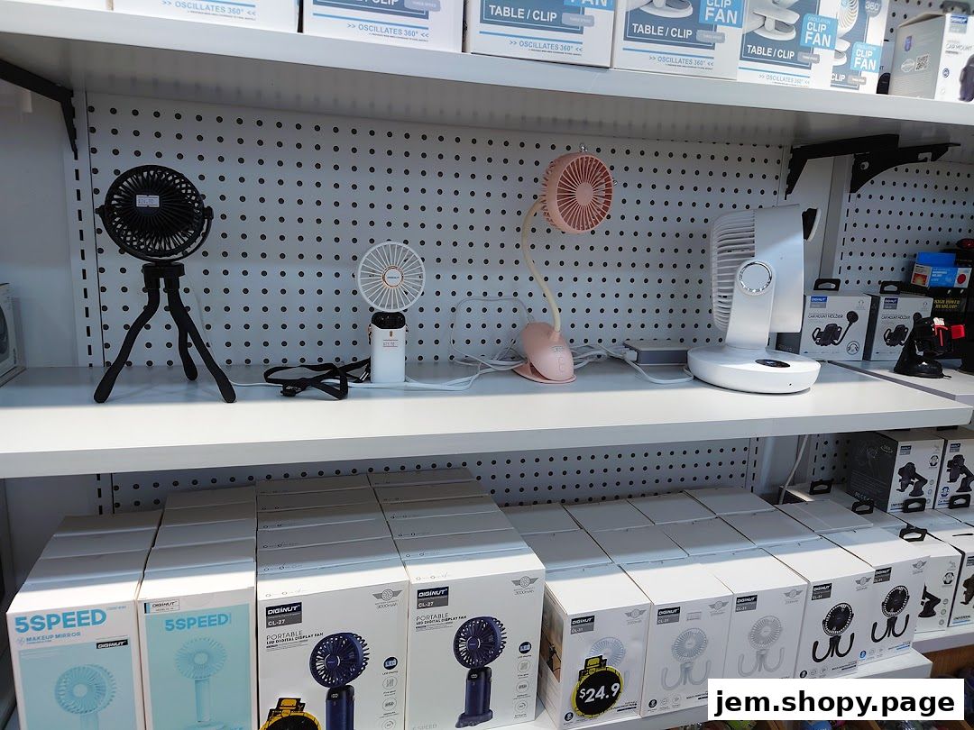 A retail display showcasing various portable fans and electronic accessories on shelves.