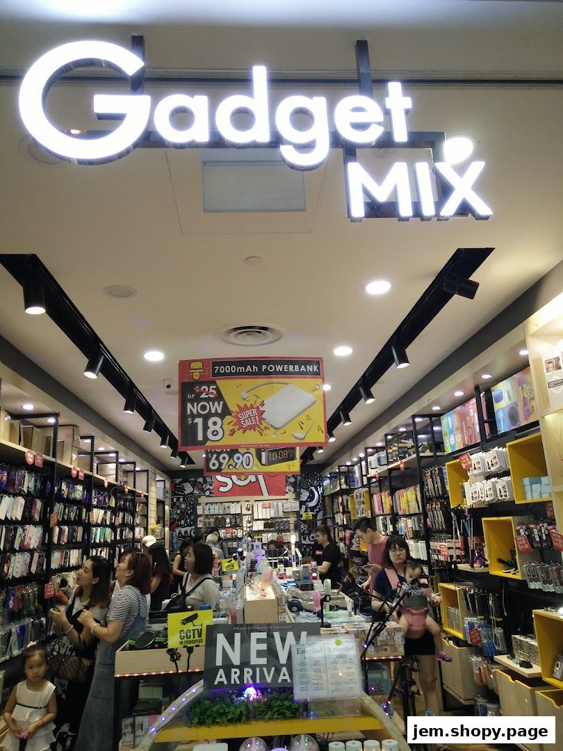 Interior view of Gadget Mix electronics store with shelves full of accessories and a promotional banner.