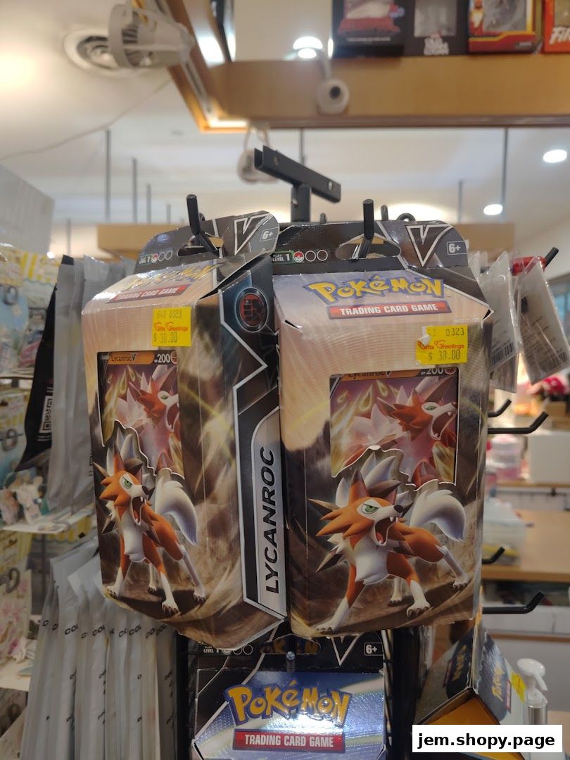 Pokemon trading card game boxes featuring Lycanroc are displayed for sale.