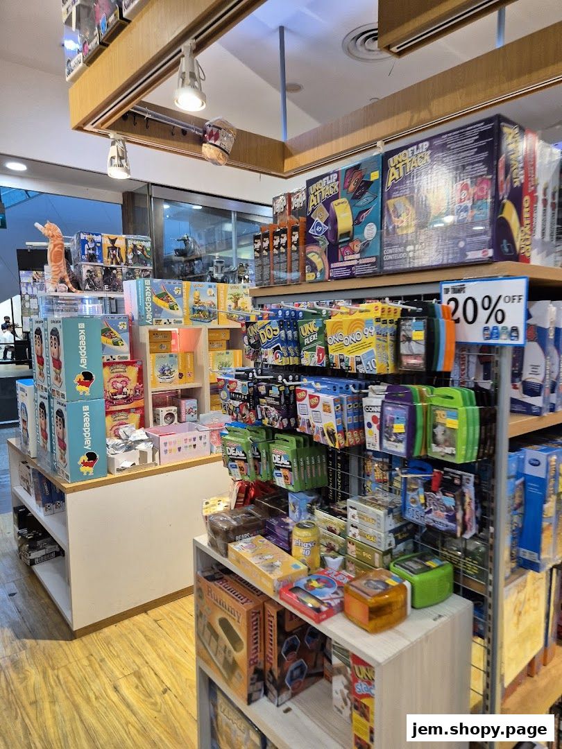 Interior view of a gift and game shop with shelves stocked with toys, board games, and collectible items.