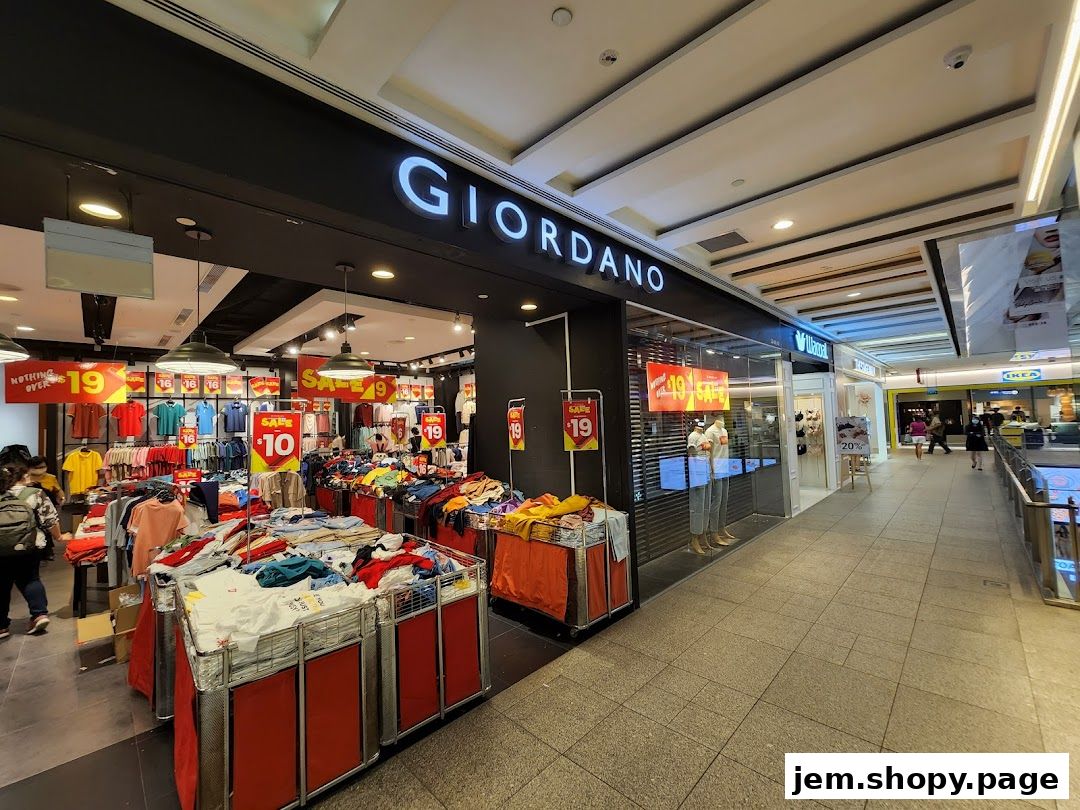 Giordano clothing store with a sale display of t-shirts and apparel.
