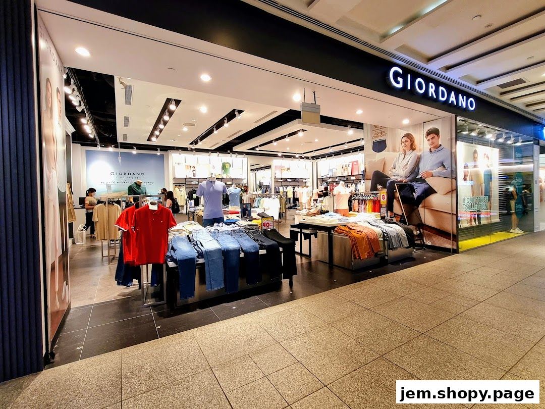 The exterior of a Giordano clothing store showcasing various apparel and promotional displays.