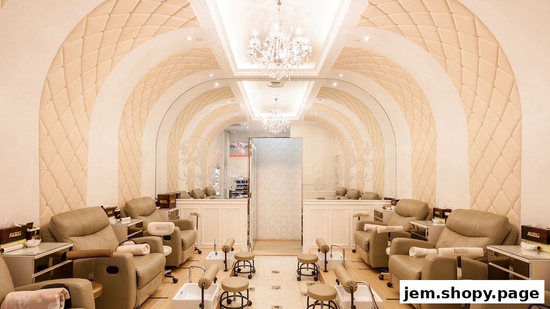 Luxurious interior of a nail and lash studio with plush seating and elegant decor.