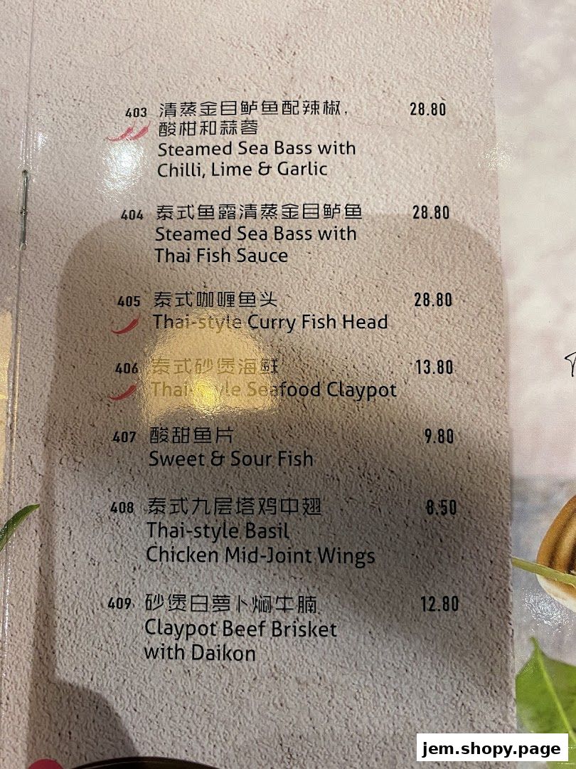 A menu page from Go-Ang Pratunam Chicken Rice JEM featuring various seafood and meat dishes.