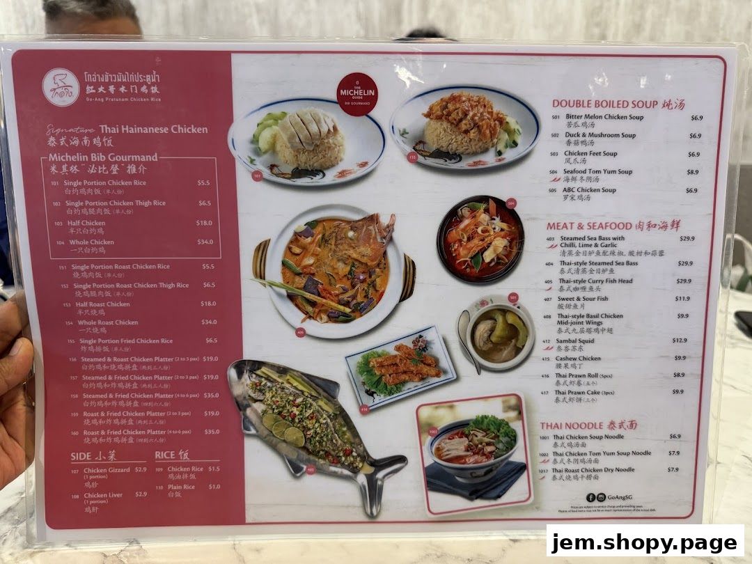 A menu from Go-Ang Pratunam Chicken Rice featuring various chicken dishes, soups, seafood, and noodles.