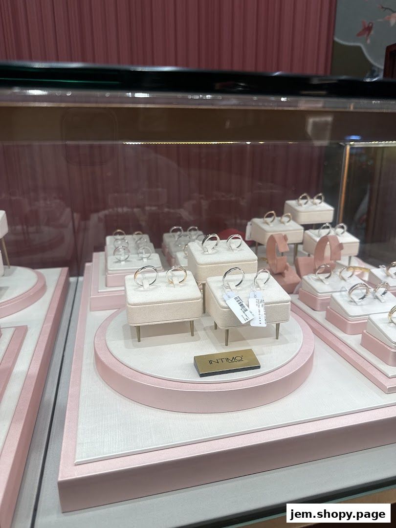 A display case filled with various rings, showcasing elegant jewelry.