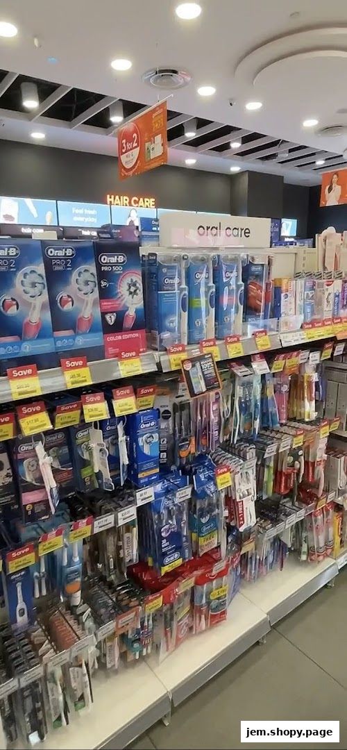 Shelves stocked with oral care and hair care products, featuring Oral-B toothbrushes and promotions.