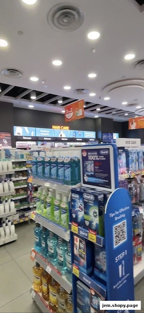 Interior view of a Guardian Health & Beauty store showcasing oral care and hair care products.