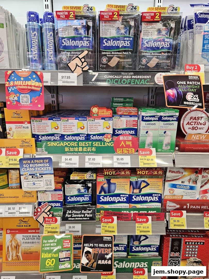 A retail display of various pain relief patches and balms, including Salonpas and Tiger Balm.