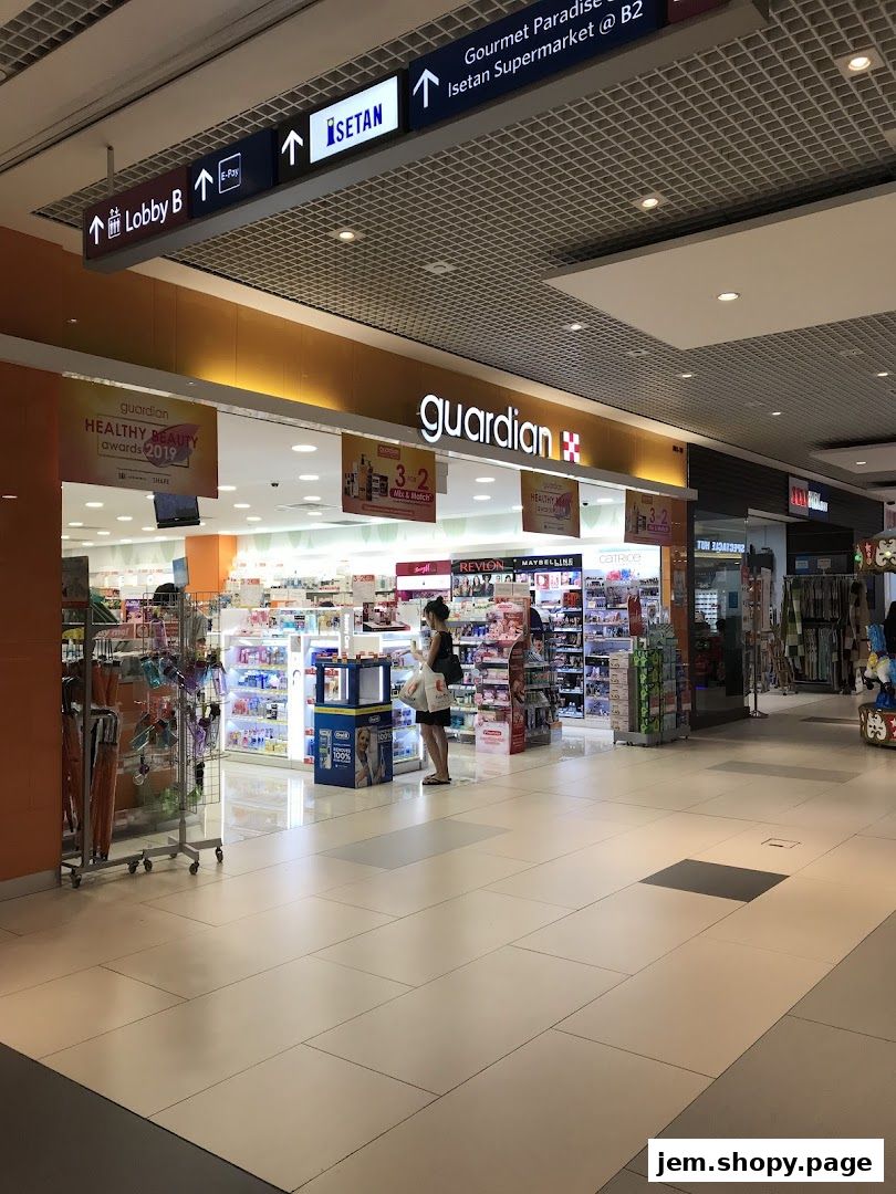 The Guardian Health & Beauty Pharmacy store entrance with various health and beauty products displayed.