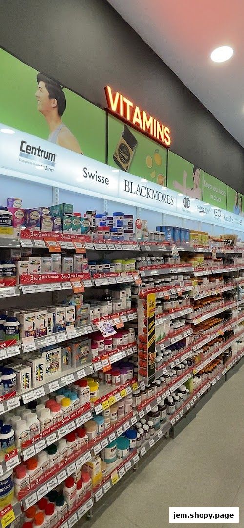 A wide selection of vitamins and supplements displayed on shelves in a retail store.