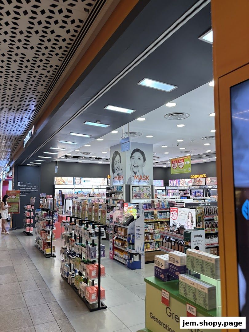 Interior view of a Guardian Health & Beauty Pharmacy with shelves stocked with health and beauty products.