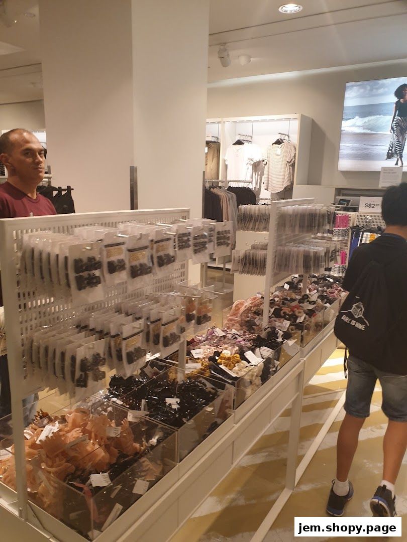Interior of an H&M store showcasing various hair accessories and clothing displays.