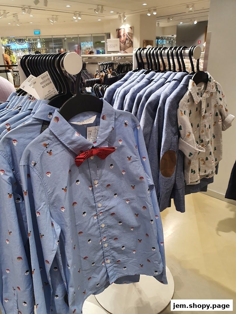 Close-up of children's shirts with festive prints and a red bow tie.