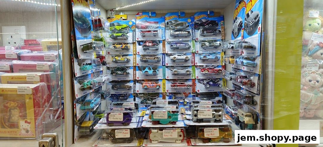 A display cabinet filled with various Hot Wheels toy cars and other collectible items.