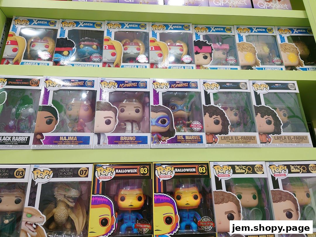 A display of various Funko Pop vinyl figures from different franchises like X-Men, Marvel, and Halloween.