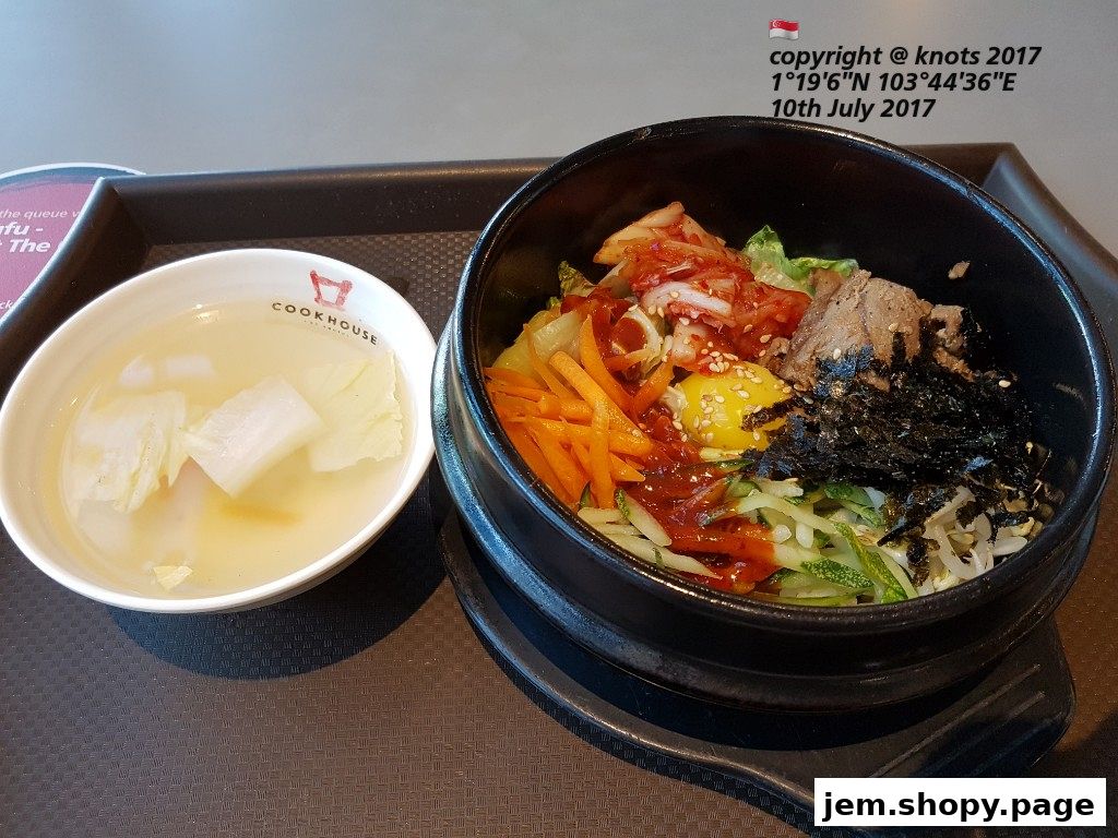 A bowl of bibimbap and a side of soup from Han Kook Kitchen.