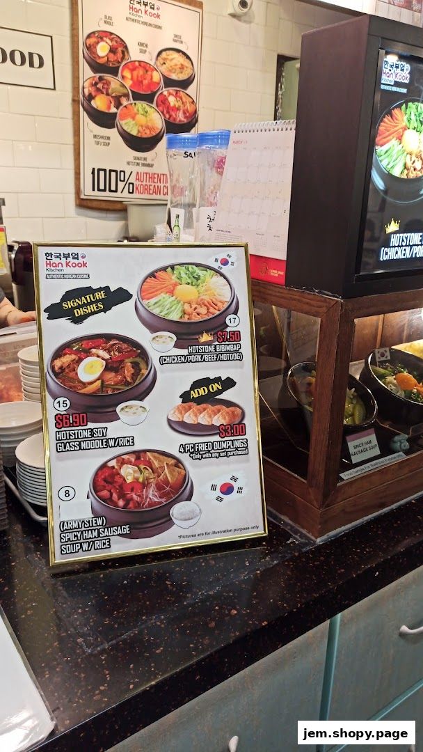 A menu board displaying signature Korean dishes with prices and images.