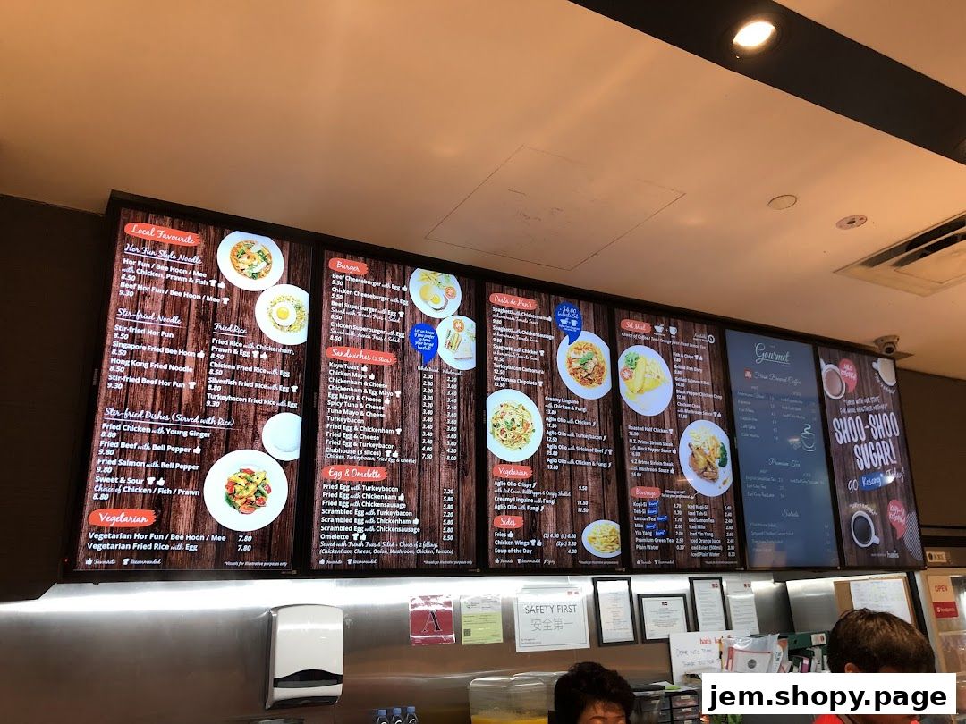 A digital menu board displaying various food and drink items with prices.