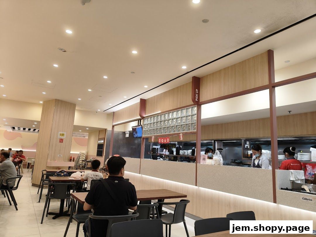 Interior view of Hans Union restaurant with diners and staff working behind the counter.