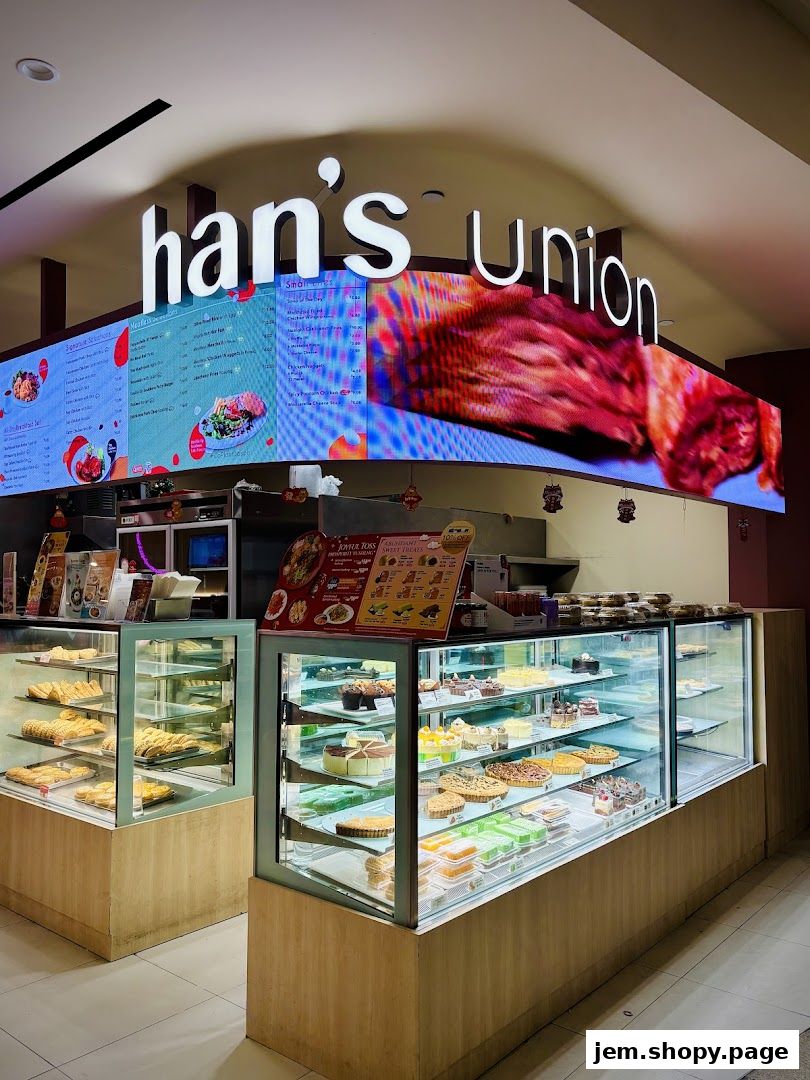 Hans Union bakery display cases filled with pastries, cakes, and desserts.