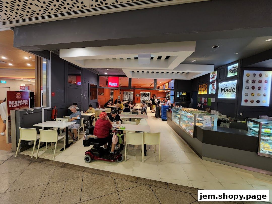 Interior view of Hans Union cafe with seating, display cases, and patrons enjoying meals.