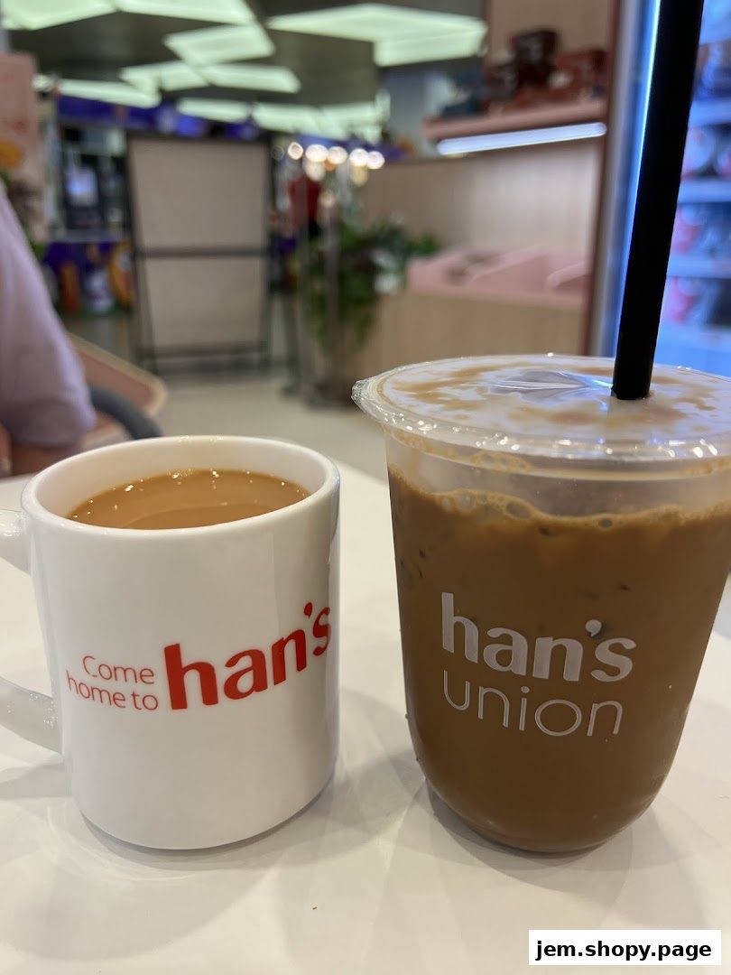 A white mug with 'Come home to han's' and an iced drink with 'han's UNION' logo.