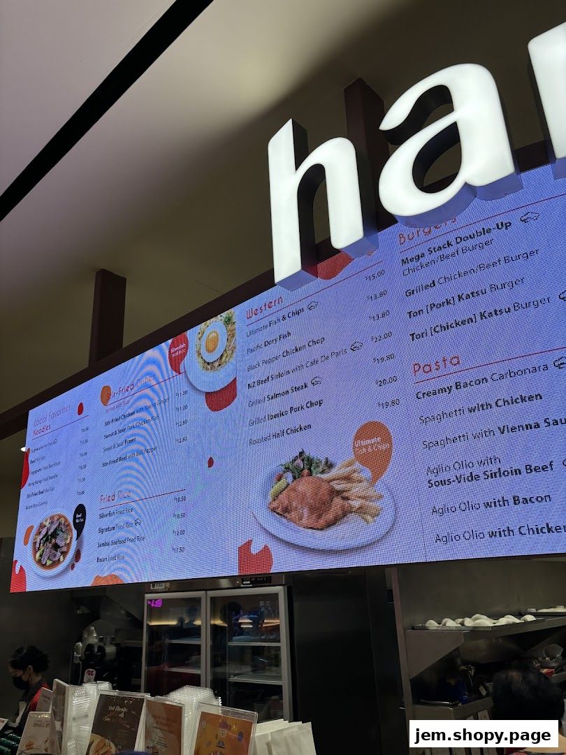 A digital menu board displaying various food items and prices for Hans Union.