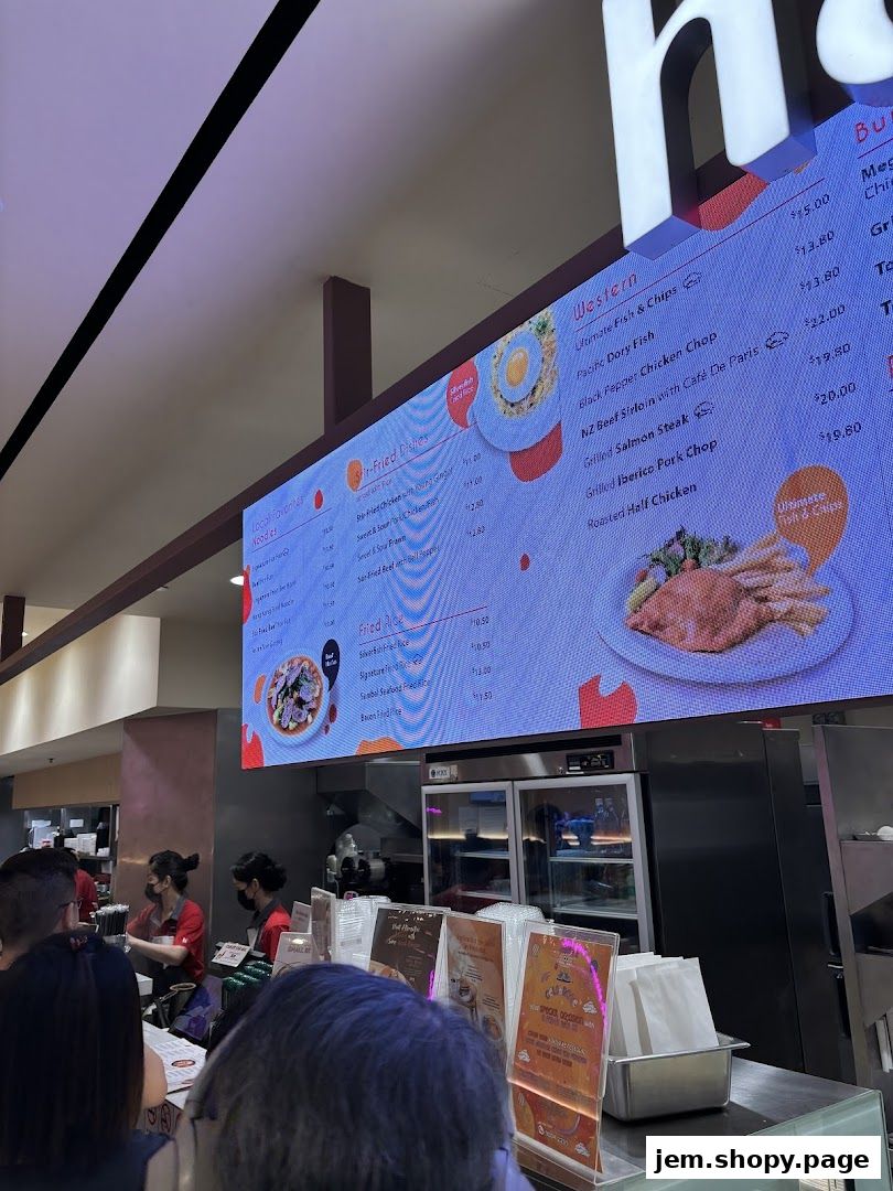 A digital menu board displays various food items and prices for Hans Union.