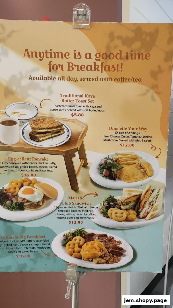 A menu board showcasing breakfast items like toast, pancakes, sandwiches, and omelets.