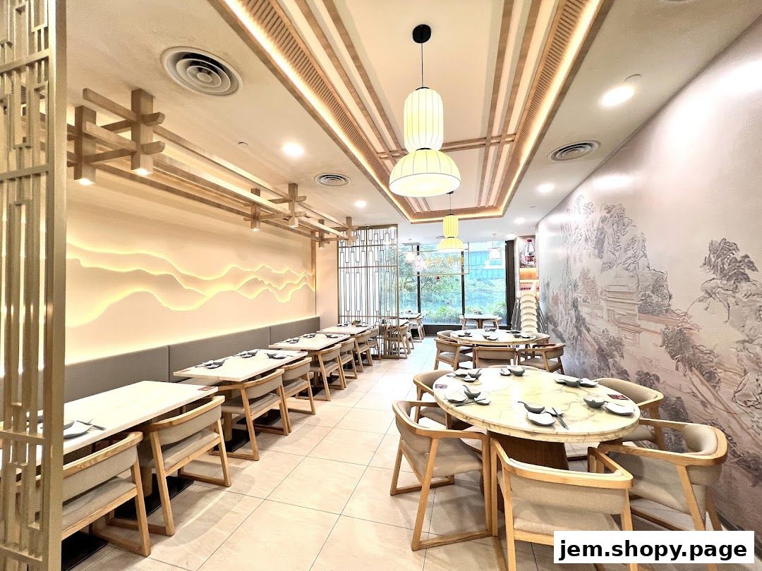 Interior of a modern Chinese restaurant with elegant decor and seating arrangements.