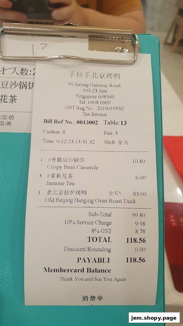 A receipt from Hand in Hand Peking Duck showing ordered items and total cost.