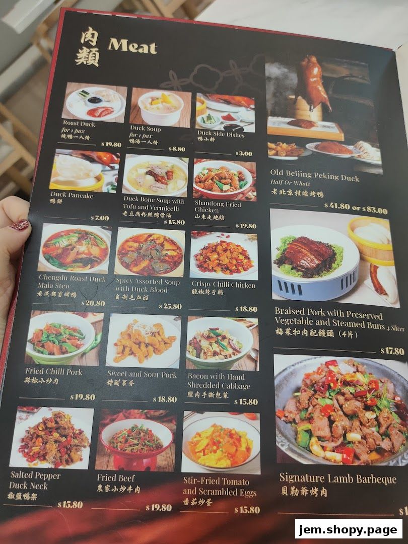 A menu page from Hand in Hand Peking Duck featuring various meat dishes and duck specialties.