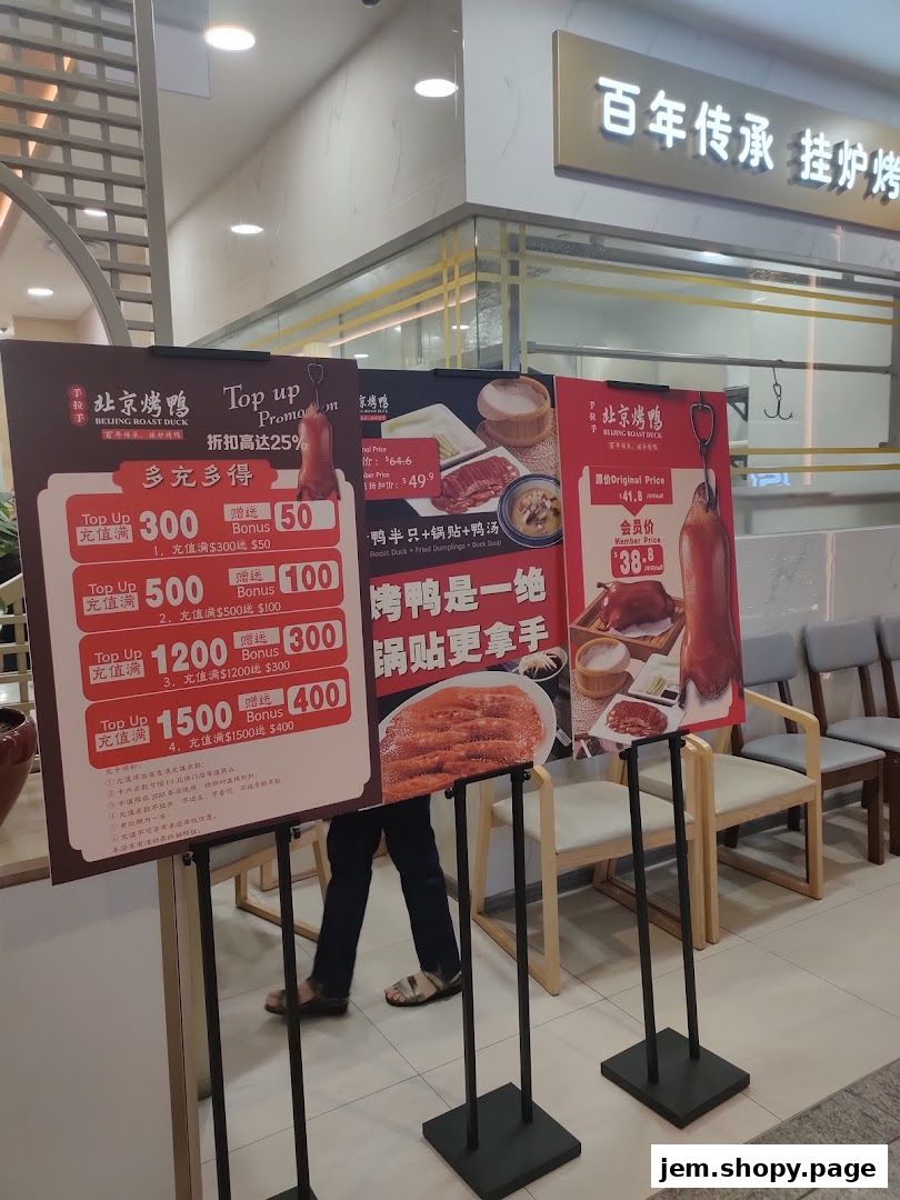 Promotional signs for Beijing Roast Duck with top-up offers and meal deals.