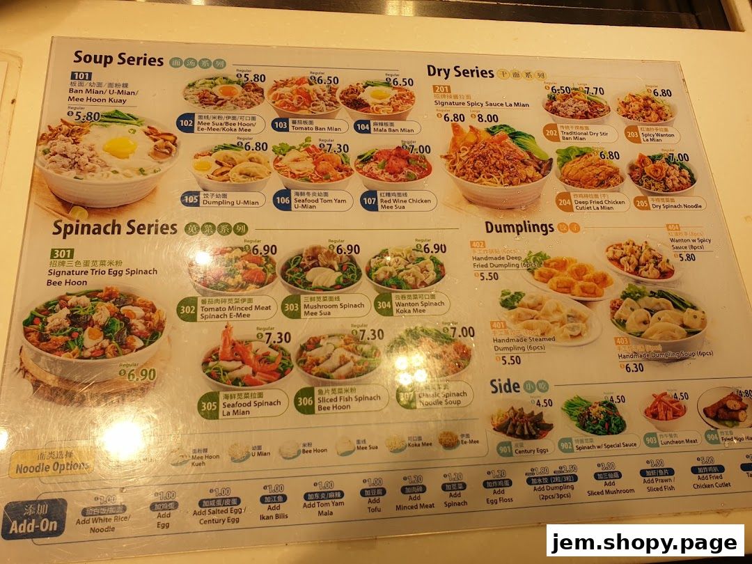 A menu board displaying various noodle dishes, dumplings, and side dishes with prices.