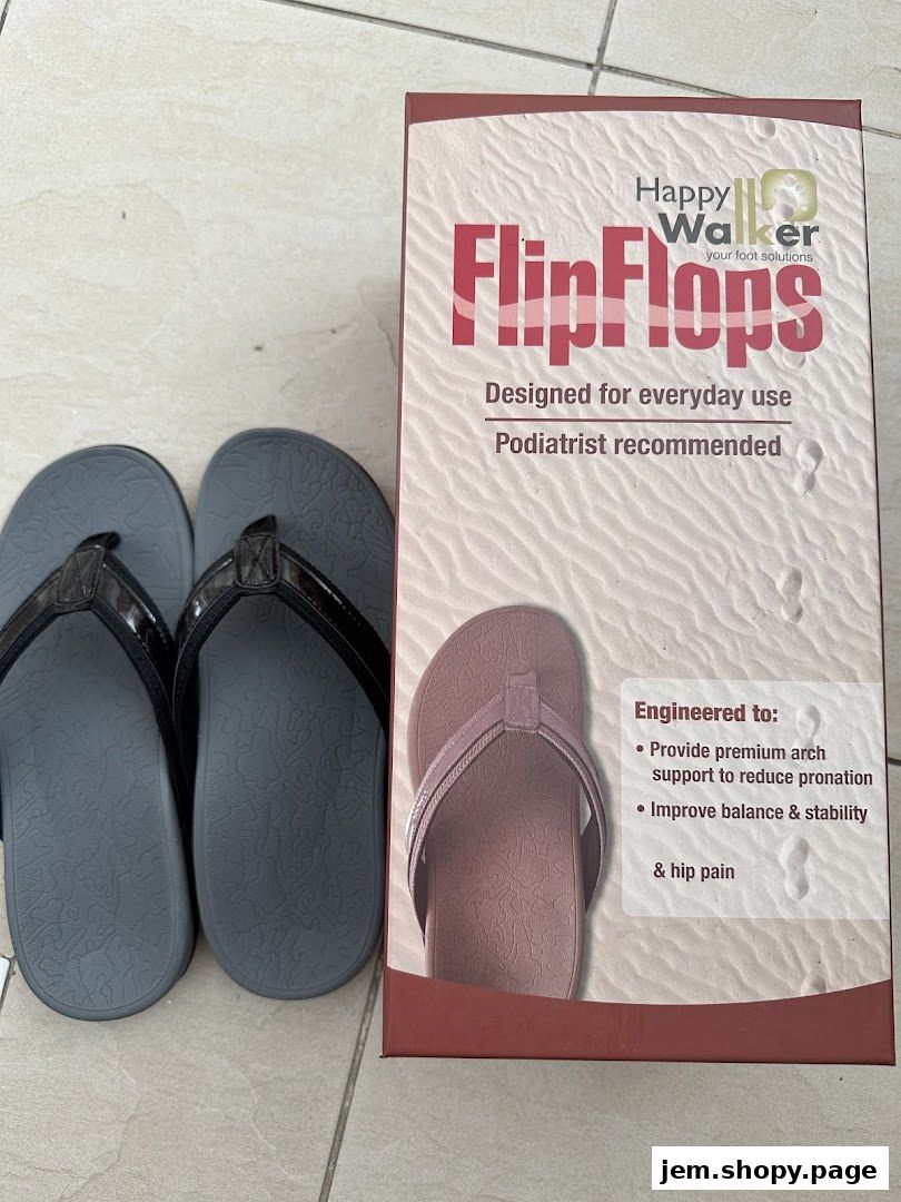 A pair of grey flip-flops next to a box for Happy Walker FlipFlops.