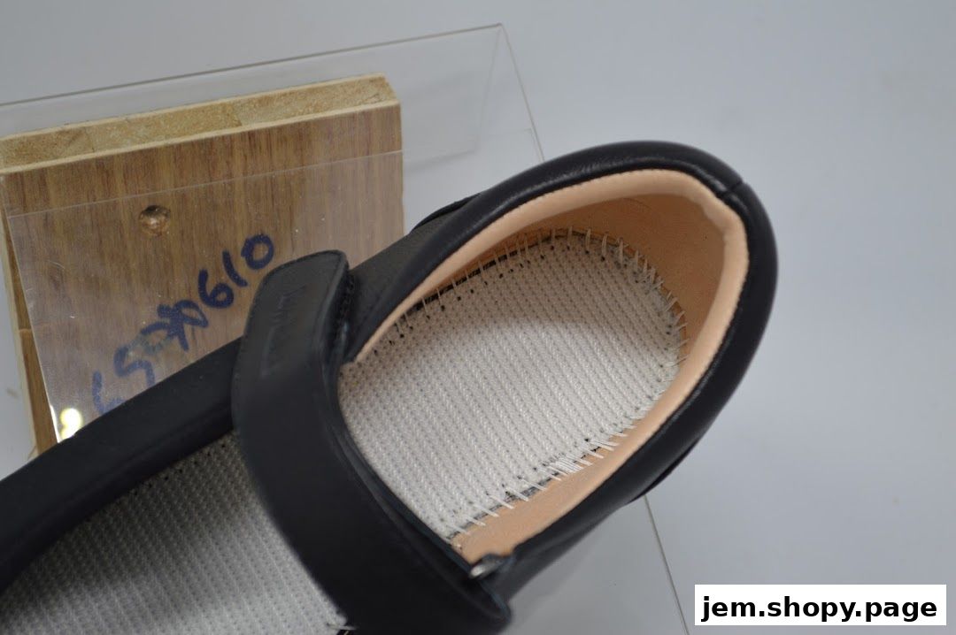 Close-up view of the interior of a black shoe with a cushioned insole.