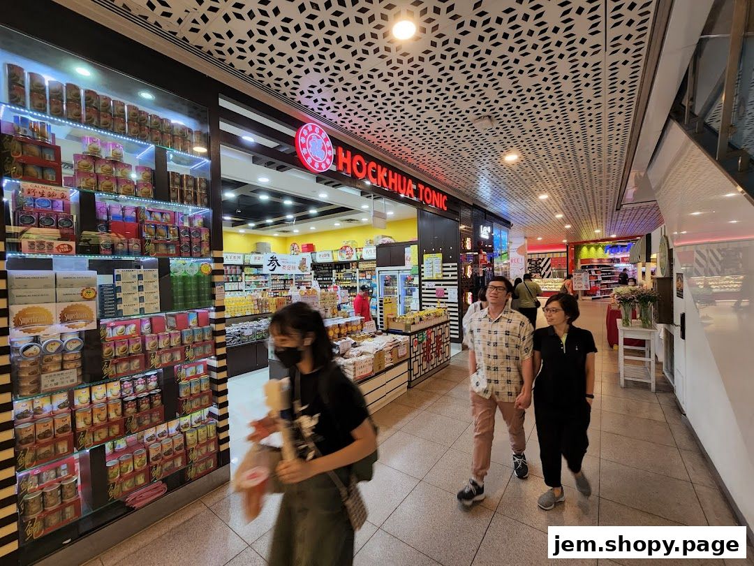 Hockhua Tonic shop front with shelves of health products and people walking by.