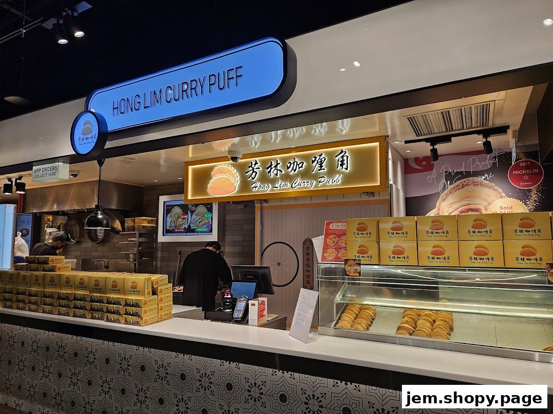 Hong Lim Curry Puff shop front with boxes of curry puffs and a display case.