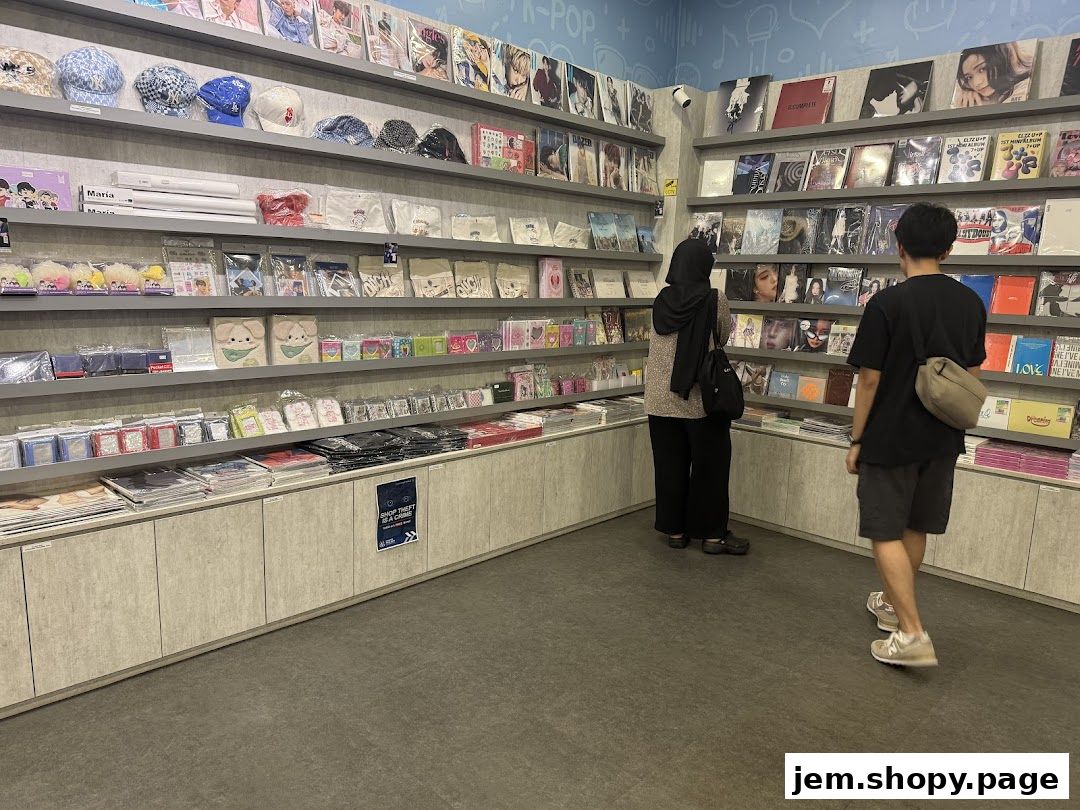 Interior of a K-pop merchandise store with shelves full of albums, merchandise, and accessories.