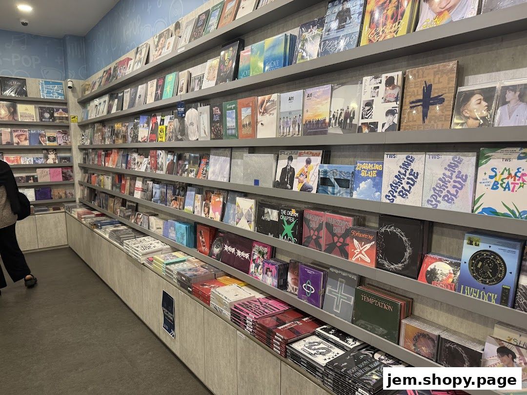 Shelves filled with K-pop albums and merchandise in a retail store.
