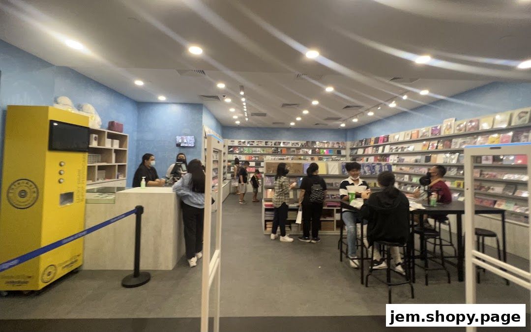 Interior of a K-pop merchandise store with shelves stocked with albums and merchandise.