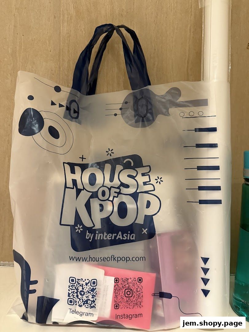 A shopping bag from House of Kpop with social media QR codes and website.