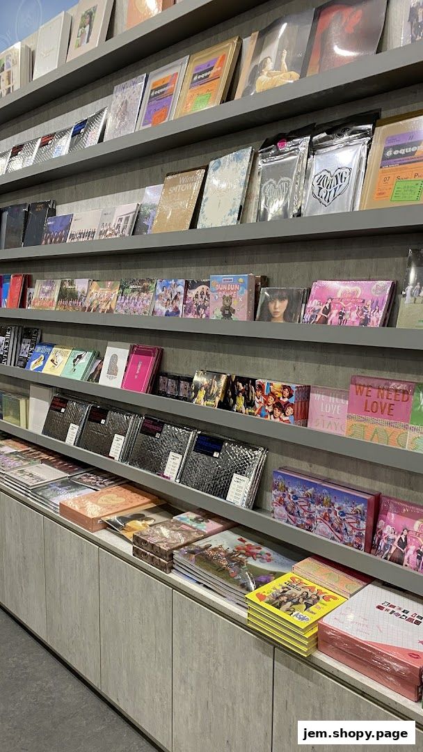 Shelves filled with K-pop albums and merchandise, showcasing various artists and releases.
