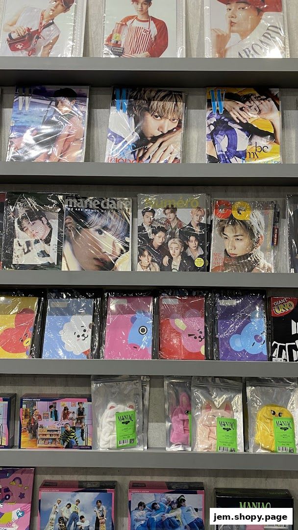 Shelves filled with K-pop merchandise including magazines, photo cards, and plush toys.