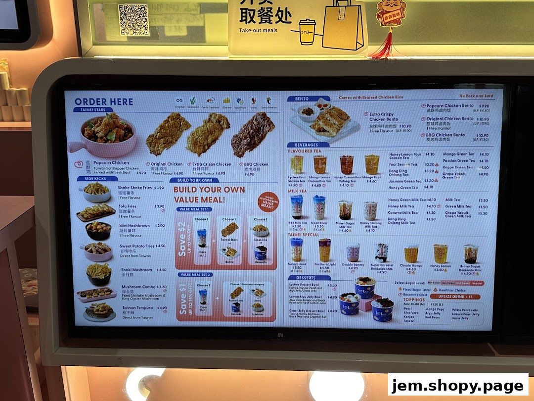 A digital menu displays fried chicken, bubble tea, bentos, and desserts with prices.