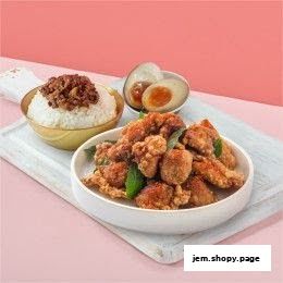 A delicious Taiwanese fried chicken meal with rice and a braised egg.