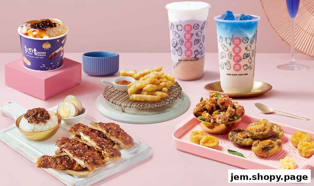 A spread of Taiwanese street food including fried chicken, fries, rice, and bubble tea.