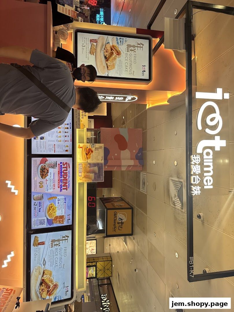 A shop front for 'I Love Taimei' selling fried chicken and bubble tea with digital menus.