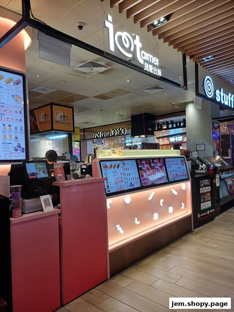 The storefront of "I Love Taimei" offering fried chicken and bubble tea with vibrant displays.